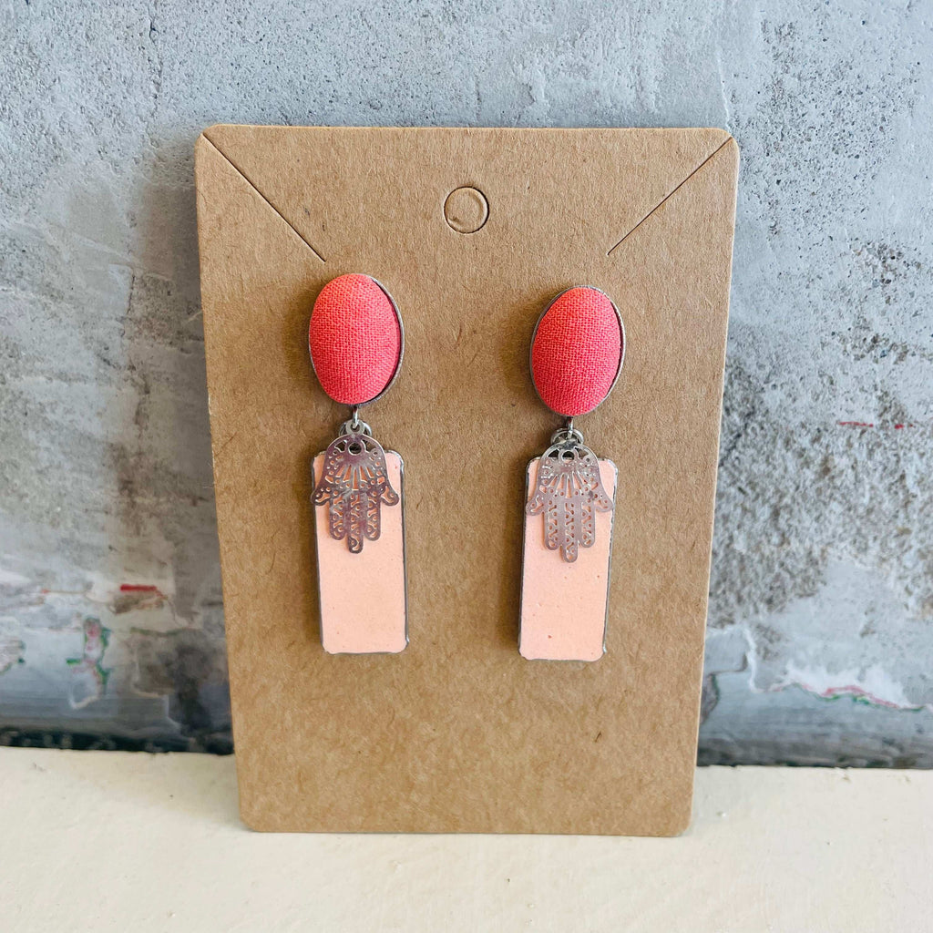 Chamsa stud earrings with pink, rectangle concrete background by Stef.co