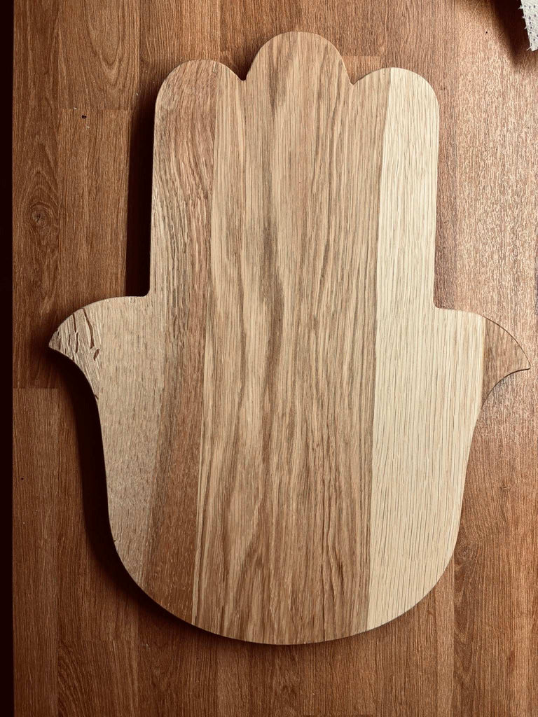 Chamsa shaped cutting board